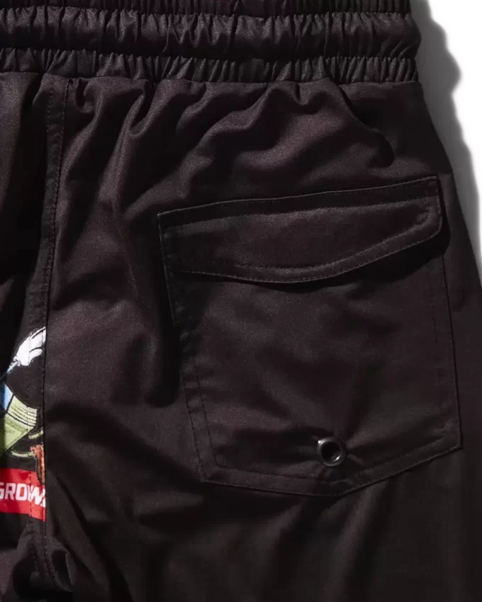 Kinder-Badehose mit Aufnähern (schwarz)