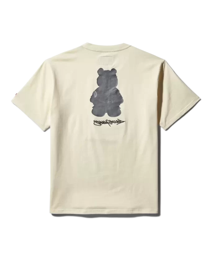 T-SHIRT MIT KURZARM UND GRAFISCHEM MONEY BEAR-MODUS (APRIKOSENFARBE)