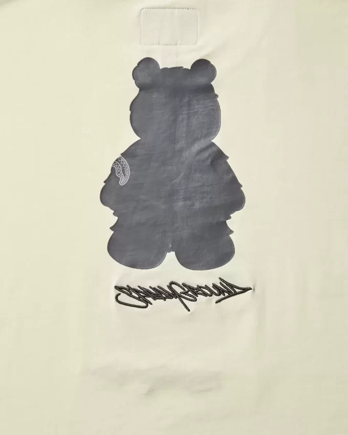 T-SHIRT MIT KURZARM UND GRAFISCHEM MONEY BEAR-MODUS (APRIKOSENFARBE)