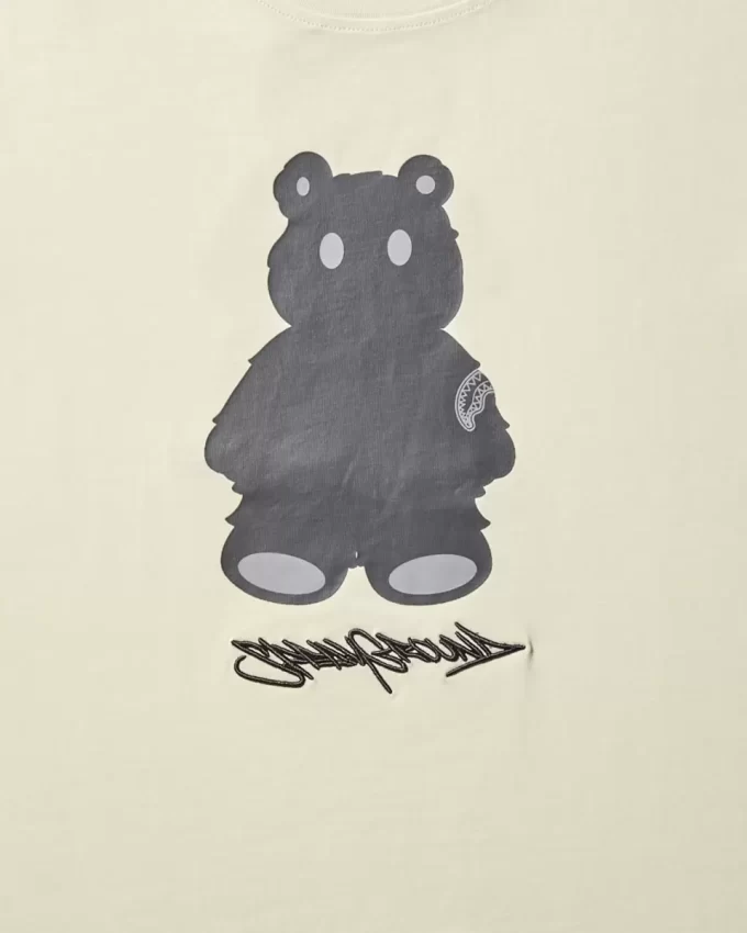 T-SHIRT MIT KURZARM UND GRAFISCHEM MONEY BEAR-MODUS (APRIKOSENFARBE)